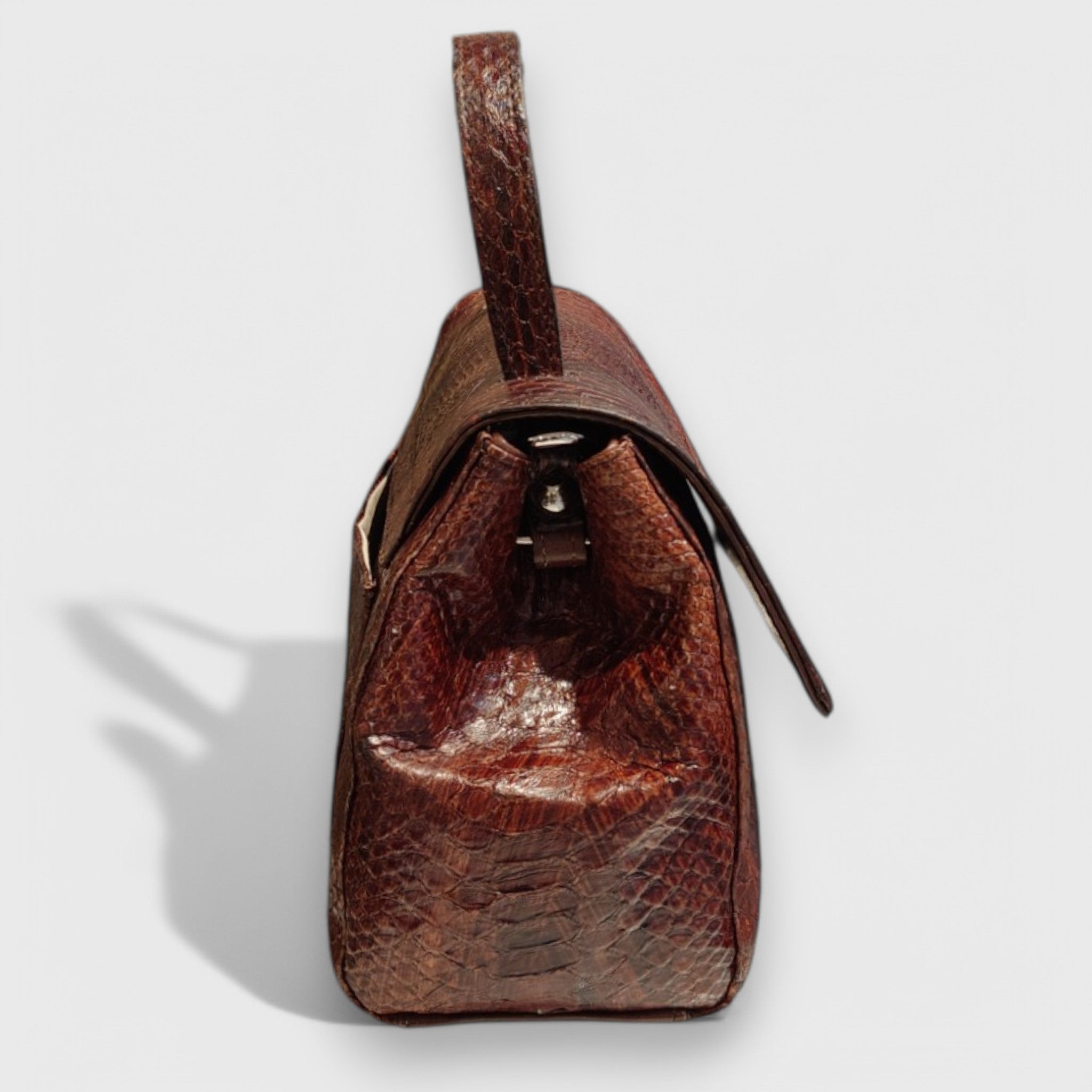 Pelletteria Pelle Nuda Milano, artigianato italiano, vera pelle, negozio borse donna, Amor pitone marrone